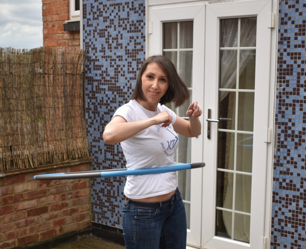 Emma with a hula hoop outdoors